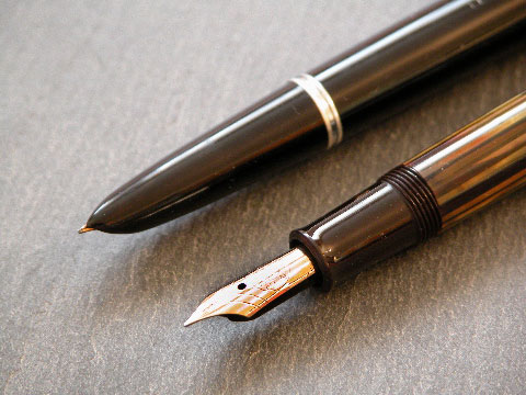 Close-up of the legendary Parker 51 ‘hooded’ nib (rear) and the traditional Pelikan 14ct gold ‘open’ nib