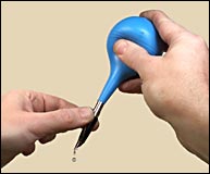 Flushing a pen with an ear
syringe